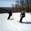 two skiers on the hill